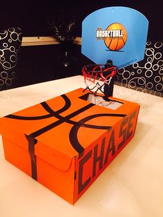 an orange box with a basketball on it and a basket in the top that says chase