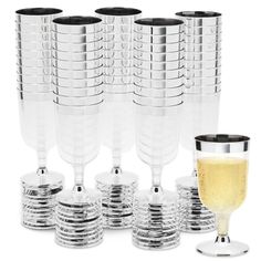 a set of six wine glasses next to each other