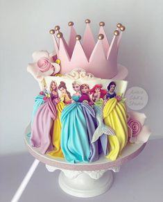 there is a cake with princesses on it