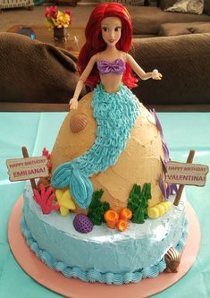 there is a birthday cake with a little mermaid on it