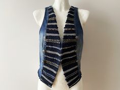 Blue Striped Denim Waistcoat Women's Blue Jeans Waistcoat Blue Denim Jeans Vest Boho Western Festival Rocker Waistcoat Cowgirl Size Medium Size: M Please check measurements to insure a proper fit. Remember to allow yourself some extra room for movement. You can compare these with something from your closet that fits you well. Measurements: Pit to pit: 17.5 inch / 44 cm Waist: 17.5 inch / 44 cm Bust: 35.5 / 90 cm Length: 21.5 inch / 54 cm Condition: Great Vintage Condition Please note that the it Blue Denim Vest With Buttons, Blue Denim Vest For Fall, Fitted Denim Blue Winter Vest, Fitted Denim Blue Vest For Winter, Festival Denim Vest With Pockets, Fitted Bohemian Denim Vest In Medium Wash, Bohemian Blue Denim Vest For Spring, Blue Bohemian Denim Vest For Spring, Blue Cotton Denim Vest For Festival