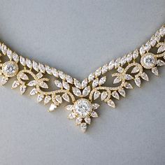 An exquisitely beautiful vintage styled necklace and earrings set that is fully encrusted with shining cubic zirconium in a scrolling flower design! This is the perfect accessory for your antique inspired wedding occasion. The necklace measure 17 inches around, 1 inch wide at the drop, and the earrings are 1/2 inch long with post pierced backs. Rhodium, rose gold, or gold plated, grade AAA CZ, nickel, cadmium, and lead free. Elegant Bridal Necklace With Intricate Cubic Zirconia Design, Opulent Cubic Zirconia Wedding Jewelry, Exquisite Cubic Zirconia Necklaces With Intricate Design, Ornate Cubic Zirconia Jewelry With Elegant Design, Exquisite Cubic Zirconia Necklace With Intricate Design, Elegant Filigree Cubic Zirconia Necklaces, Elegant Cubic Zirconia Filigree Necklaces, Exquisite Filigree Diamond Necklace For Wedding, Elegant Filigree Necklace With Cubic Zirconia