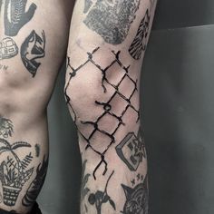 tattoos on the legs and arms of a man with barbed wire around his ankles,