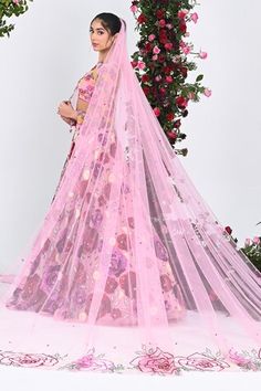 Rose pink attached cancan lehenga with all over gulaab garden embroidery using tonal 3D sequins, beads, cutdana highlights. Paired with a three fourth sleeves padded blouse with rosa cutdana embroidery, border embroidered net veil and a dupatta. - Aza Fashions Pink Organza Lehenga With Pallu, Pink Organza Saree Lehenga, Pink Organza Sharara With Pallu, Pink Organza Sharara With Pallu Detail, Pink Bollywood Organza Lehenga, Pink Organza Bollywood Lehenga, Pink Bollywood Style Organza Lehenga, Bollywood Style Pink Organza Lehenga, Semi-stitched Pink Organza Lehenga