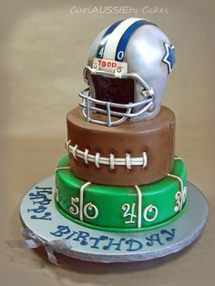 a three tiered cake with a football helmet on top