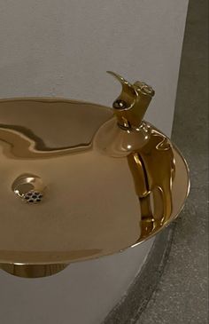 a bathroom sink that is gold in color