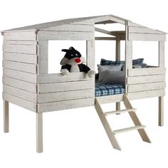 a white wooden bunk bed with a blue pillow on the bottom and stairs leading up to it