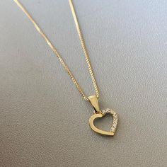 "14K Solid Gold Heart Necklace, Dainty Heart Pendant, Open Heart Delicate Minimalist Pendant, 14k Yellow This necklace can be a great gift for a family member, girl, daughter, mother, girlfriend, wife, or for yourself. ✔ Made to Order ✔ Gold Kt: 14K ✔ Necklace length: 45cm ✔ Pendant weight: 0.6g ✔ Handmade: Yes ✔ Dimensions: 9 mm x 9mm. ✔ Solid Gold Chain 1.3 g ✔ Ready to Ship in 3 Business Days Solid gold pieces are made to last forever. Since gold is one of the reactive metals, it scratches le Heart Shape Gold Ring, Simple Chain With Pendant Gold, Simple Chains Gold, Small Gold Pendant, Girlfriend Necklace Gift, Small Heart Necklace, Gold Pendent, Promise Necklace, Gold Bangles For Women