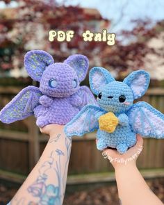 two small crocheted stuffed animals held in their hands with the caption pop tiny