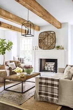 a living room filled with furniture and a fire place