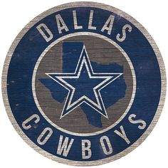 a wooden sign with the word dallas cowboys on it and a star in the center