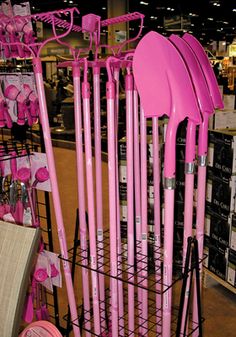 pink utensils are on display in a store