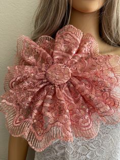 a close up of a mannequin wearing a dress with pink flowers on it