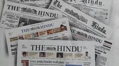 newspapers are stacked on top of each other with the words hindu printed on them in black and white