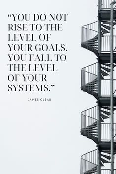 a spiral staircase with a quote from james clear on the top and bottom part of it