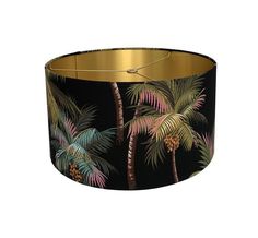 a lampshade with palm trees on black and gold foiled paper, hanging from the ceiling