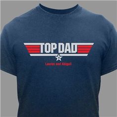 Our Personalized Top Dad T-Shirt is a great gift for Dad for any occasion. Featuring a spoof of the Top Gun Logo, any Dad is sure to wear this T-shirt with pride. Let everyone know that your Dad is the Top Dad by presenting him with this great Persona Father's Day Team Spirit Graphic T-shirt, Father's Day Team Spirit Tops With Graphic Print, Father's Day Cotton T-shirt With Team Spirit, Father's Day Team Spirit T-shirt With Crew Neck, Father's Day Team Spirit Crew Neck T-shirt, Patriotic Father's Day T-shirt With Letter Print, Patriotic Letter Print T-shirt For Father's Day, Patriotic Father's Day Letter Print T-shirt, Father's Day Blue Top With Funny Text