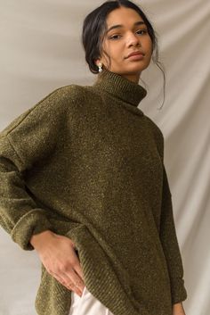 Our classic boucle knit jumper, with a roll neck and made from a 60% wool mix; perfect for layering in the chillier months. Features a flecked detail to the knit, an unbalanced hemline, dropped shoulder sleeves and a small Olive tab stitched to one side of the seam. The boucle is boxy in cut and is made for a relaxed and slouchy fit. Olive Clothing, High Neck Jumper, Knitwear Design, Fall Winter Outfits