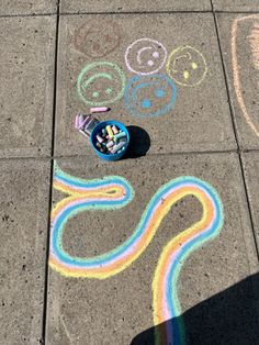 the sidewalk has been decorated with chalk and crayons for this child's art project