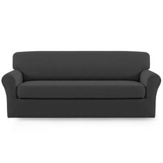 a black couch sitting on top of a white floor