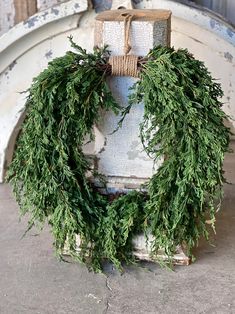 a wreath on top of an old fire hydrant