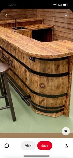 a wooden bar with two stools next to it