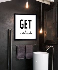 a bathroom with black walls and white fixtures