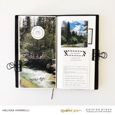 an open photo book with trees in the background and water running down it's side