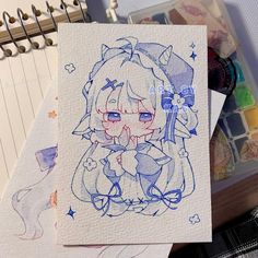 a drawing of a girl with blue eyes and an umbrella in her hand next to some art supplies