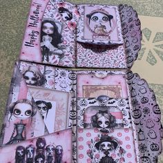 the inside of a box with pictures and skulls on it, all decorated in pink