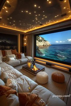 a living room filled with furniture and a flat screen tv mounted to the side of a wall