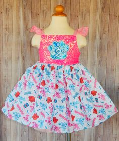 a dress on a mannequin with pink and blue flowers