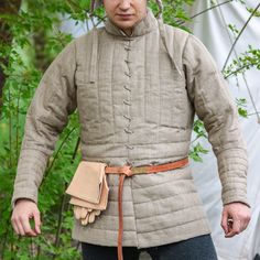 🌿💪 Crafted in the heart of Europe! Natural materials! Introducing our Catalan Knight's Gambeson, a masterpiece of medieval attire that encapsulates the essence of chivalry and tradition. Crafted with meticulous attention to detail, this gambeson serves as an essential component of every knight's wardrobe. 🛒 Visit our shop on Etsy: https://www.etsy.com/pl/shop/SPESMedievalMarket  📝 Key Features  ◾ Authentic Catalan design inspired by 14th-century altar painting. ◾ Premium linen construction f Padded Armor, Medieval Attire, Armor Medieval, Heart Of Europe, Medieval Clothing, 14th Century, 15th Century, Mens Costumes, Poland