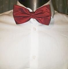 Claret red silk bow tie by Austin Reed. Adjustable length. Classic Red Ties For Party, Elegant Red Adjustable Bow, Red Bow Tie For Formal Suit, Classic Red Bow Tie For Formal Occasions, Red Bow Tie As A Gift, Adjustable Red Bow Tie Suit Accessories, Elegant Red Bow Tie Adjustable, Red Bow Suit And Tie Accessories For Business, Red Adjustable Tie For Formal Occasions