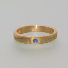 This ring is our popular 4 mm, 14 kt yellow gold casting ring. However, this particular ring features a 1.0.31 inch, 8 mm sapphire gemstone. Upon request, the ring can also be crafted with rose-colored or white gold. The shown price refers to a ring with a size of 48. Different prices can be shown by selecting the appropriate ring size. For example, a pair of rings with sizes of 52 and 59 would cost around For men, the ring can be ordered without the gemstone. You can also choose to include a na Yellow Gold Ruby Ring With Tension Setting, 14k Gold Sapphire Promise Ring With Polished Finish, Gold Ruby Ring With Tension Setting For Formal Occasions, 14k Gold Sapphire Ring With Polished Finish, Gold Emerald Ring With Tension Setting For Promise, Yellow Gold Sapphire Ring With Polished Finish, Polished Yellow Gold Sapphire Ring With Round Band, Gold Stackable Rings With Round Cut Sapphire, Gold Sapphire Stackable Rings