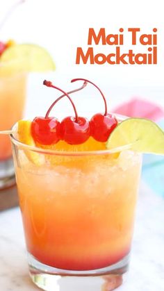 two glasses filled with orange juice and cherries