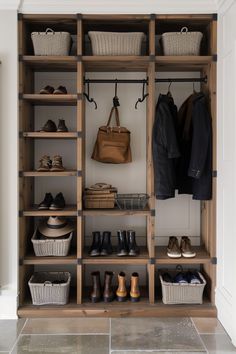 an organized closet with baskets and shoes