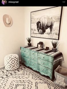 a living room with a rug, table and chair