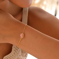 Elegant gold-plated bracelet with a delicate lotus flower charm, perfect for anniversaries, birthdays, or as a romantic gesture.Discover the epitome of elegance and grace with our Lotus Flower Charm Gold Bracelet for Women, a timeless piece of jewelry that captures the beauty of serenity in its design. This exquisite bracelet features a gold-plated chain that glimmers with a warm, golden hue, complemented by a delicate lotus flower charm that symbolizes purity, enlightenment, and rebirth. Each p Gold Plated Flower Shaped Bracelets As Gifts, Gold Flower Shaped Elegant Bracelets, Gold Bracelets With Birth Flower, Gold Flower-shaped Bracelet With Flower Decoration, Lotus Flower Bracelet, Elegant Gold Flower-shaped Bracelets, Gold Lotus Flower Jewelry For Gift, Elegant Lotus Flower Jewelry Gift, Adjustable Rose Gold Flower-shaped Bracelet