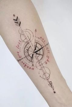 a compass tattoo on the arm