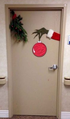 a door decorated with christmas decorations and handprints