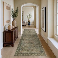 the hallway is clean and ready for us to use as an entrance way in this home