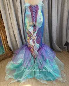 a mermaid costume is displayed on a mannequin