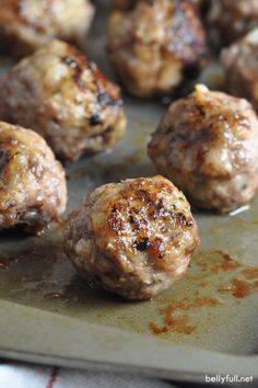 cooked meatballs on a baking sheet ready to be eaten