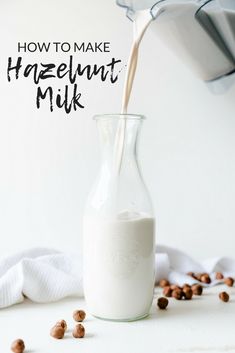 a glass bottle filled with hazelnut milk being poured into it