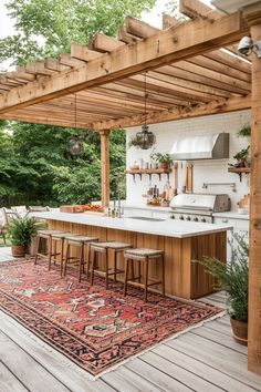 an outdoor kitchen and dining area is shown