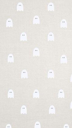 a white fabric with ghost faces on it