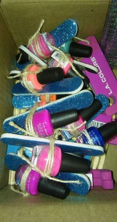 a box filled with different types of shoes and nail polish on top of each other