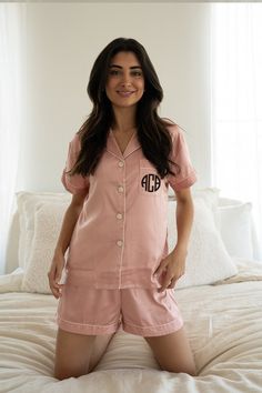 Experience the luxury feel of our satin blend pajamas infused with spandex for maximum flexibility and comfort. Perfect for lounging around or drifting off to sleep. Immerse yourself in our breathable and fluid sleepwear fabrics, the perfect retreat to whisk you away to dreamland. Featuring delicate design details like pearlized shell shirt buttons, cuff hems, and contrast piping trim. Add a sentimental touch with our printed personalization option, making these pajamas the perfect gift for a loved one or keepsake for your own sleepwear collection. Purchase includes the top & bottoms set. See photos for size guide. Colors may slightly vary due to screen settings.  Care: Machine wash in warm water on a *delicate* cycle with low agitation. Tumble dry low or hang to dry. Do not dry clean. Ple Pink Satin Sleepwear For Lounging, Pink Satin Sleepwear For Nightwear, Pink Satin Loungewear Sets, Pink Satin Home Sets, Pink Satin Finish Sleepwear For Wedding Night, Pink Satin Sets For Wedding Night, Pink Satin Pajama Party Sets, Pink Satin Sleepwear For Bedtime, Pink Satin Pajamas