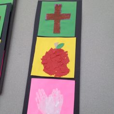 two handprints are placed next to each other on a table with paper and scissors